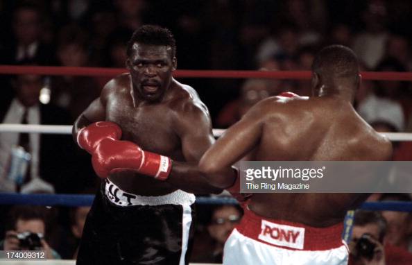 tony-tubbs-looks-to-land-a-punch-against-riddick-bowe-during-the-at-picture-id174009312