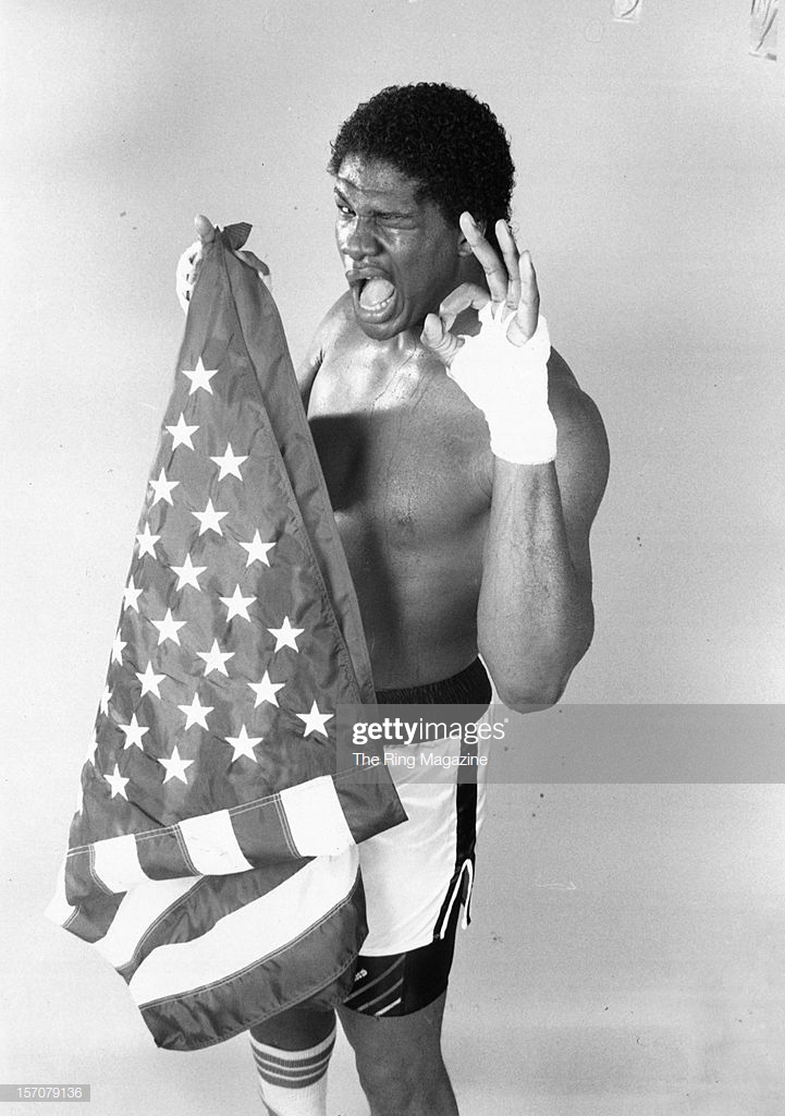 olympian-riddick-bowe-poses-with-the-american-flag-in-july-1988at-picture-id157079136