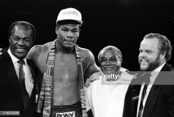 riddick-bowe-poses-with-mayor-marion-barry-trainer-eddie-futch-and-picture-id174012038